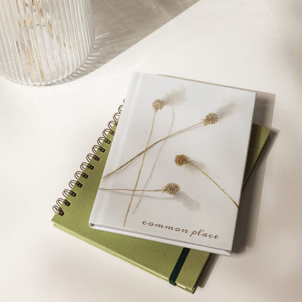 A hardcover journal featuring the “From Ella” watercolor
